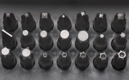 Close-up top view of professional presented orderly bits and attachments for cordless screwdrivers...