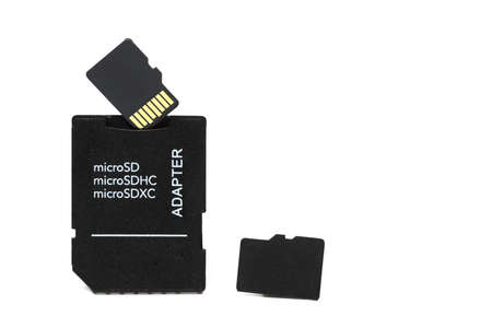 Close up of Micro SD card to card adapter next single storage card port for connecting various media...