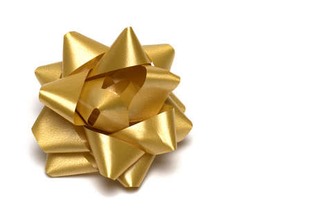 Close up of gift stitch artfully created from golden gift ribbon for decoration on packages and...