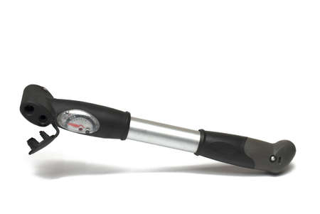 Close up of small universal bicycle hand air pump with nanometer red pointer black handle and silver shaft on white backgroundの写真素材