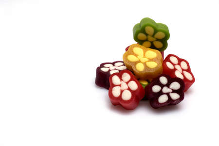 Close up of colorful red yellow green gum candy stacked on top of each other and side by side in...