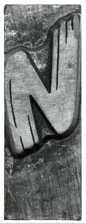 retro macro vintage close-up uppercase capitol N white background for print text setting metal printer lead letterの写真素材