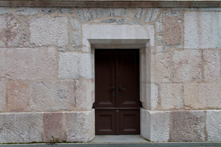 Closeup stone wall historic facade door backgroundの写真素材