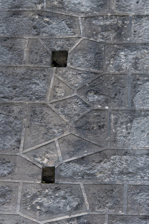 Closeup stone wall historic joints facade backgroundの写真素材