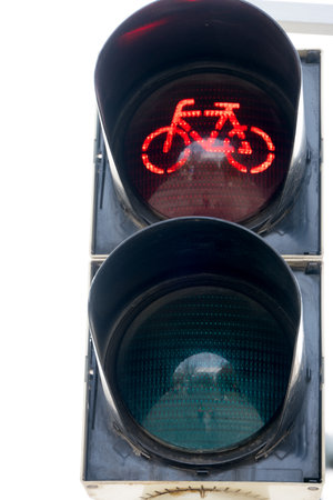 Close up of cyclist traffic light showing red light and bicycle as concept for bike trafficの写真素材