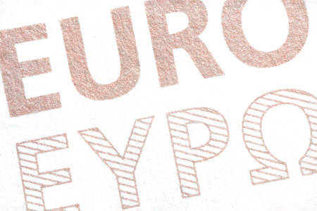 Extreme detailed close up macro of a euro banknote with inscription euro also in Greek letters as a concept for the common currency money in the EU and monetary unionの写真素材