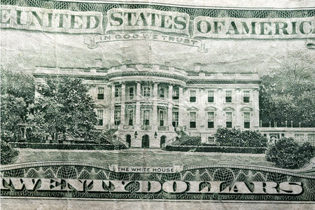 Extreme partial macro photo the White House on a us usa twenty dollar banknote with the inscription the united states of america white house twenty dollar and in god we trustの写真素材
