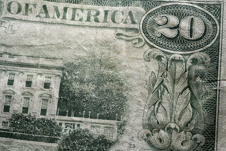 partial extreme closeup macro shot american dollar twenty 20 bill banknote word america part of white houseの写真素材