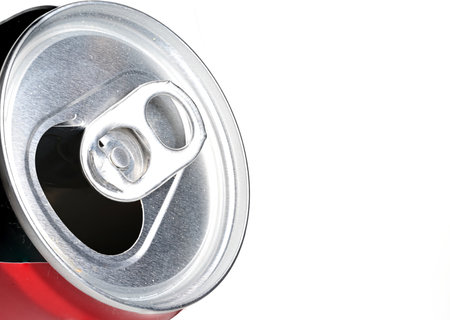 Partial side view close up of silver aluminum beverage can with open cap on white background as concept for soft drinks and reusable recyclable binsの写真素材