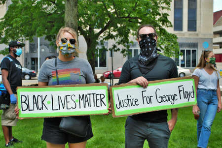 Dayton, Ohio, United States 05/30/2020 protesters at a black lives matter rally holding signs and...