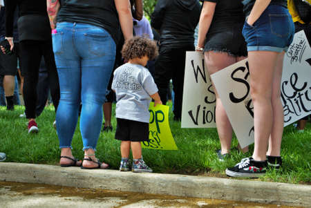 Dayton, Ohio, United States 05/30/2020 protesters at a black lives matter rally holding signs and...