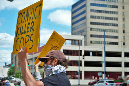 Dayton, Ohio, United States 05/30/2020 protesters at a black lives matter rally holding signs and...