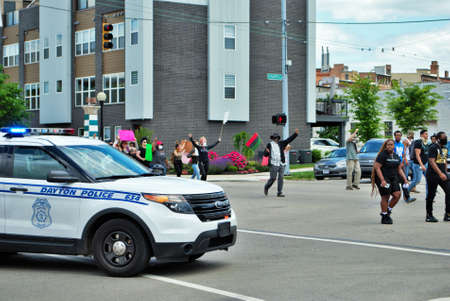 Dayton, Ohio, United States 05/30/2020 protesters at a black lives matter rally marching down the street holding signs and wearing masksのeditorial素材