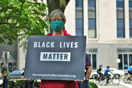Dayton, Ohio, United States 05/30/2020 protesters at a black lives matter rally marching down the street holding signs and wearing masksのeditorial素材