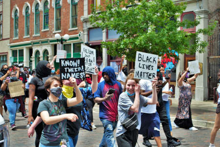 Dayton, Ohio, United States 05/30/2020 protesters at a black lives matter rally marching down the street holding signs and wearing masksのeditorial素材