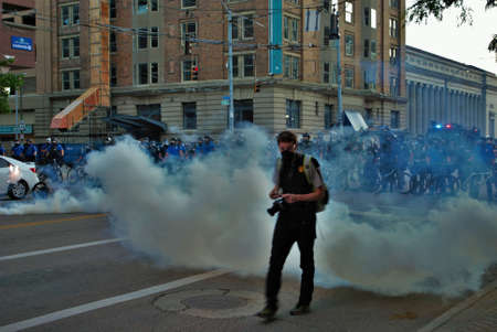 Dayton, Ohio United States 05/30/2020 police and SWAT officers through a cloud of tear gas at a black lives matter protestのeditorial素材