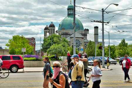 Dayton, Ohio, United States 05/30/2020 protesters at a black lives matter rally marching down the street holding signs and wearing masksのeditorial素材