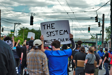 Dayton, Ohio, United States 05/30/2020 protesters at a black lives matter rally marching down the street holding signs and wearing masksのeditorial素材