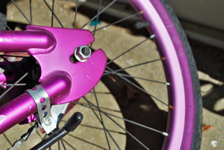 selective focus close up of parts on a childs bikeの写真素材
