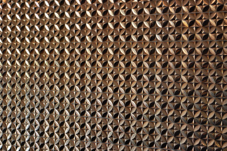 Gold wall tile with unique texture and shape background copy space