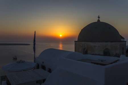 Beautiful Sunset happening at the town of Oia in Santorini, Greeceの写真素材
