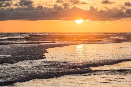 Sunset over the sea in Yogyakarta, Indonesiaの写真素材