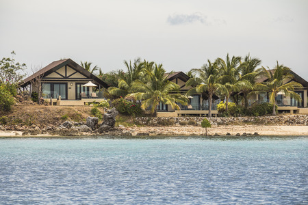 Vacation resort cottages near water on philippine islandの写真素材