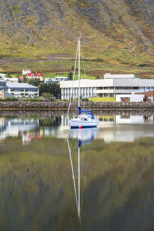 Fjord and boats reflection at Isafjordur town, Icelandの写真素材