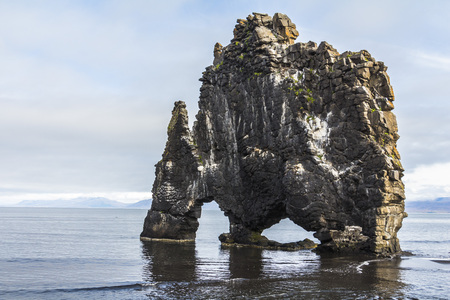Hvitserkur stone arch on beach in Icelandの写真素材