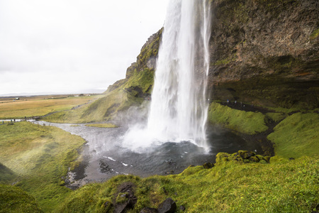 Beautiful Seljalandsfoss waterfall falling in pool, scenic, Iceland