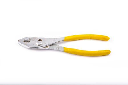 yellow pliers on a white screen