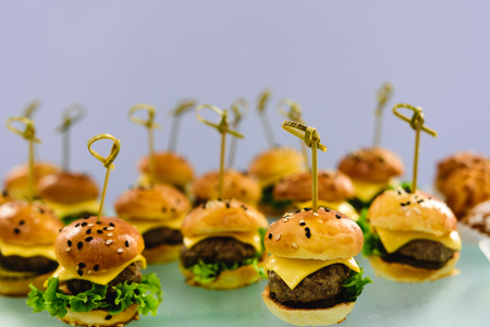 Delicious mini cheeseburgers. Selective focus. Catering for party.の写真素材