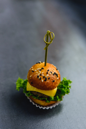 Delicious mini burger on gray background. Selective focusの写真素材
