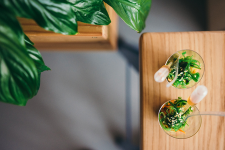 Two mini salads with sauce. Selective focus.Top view with copy space for text or advertisingの写真素材