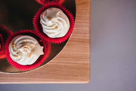 Chocolate cupcakes with  cream cheese icing with space for text. Top viewの写真素材