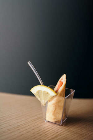 Appetizer stuffed pancake with salmon and lemon. Selective focus.の写真素材