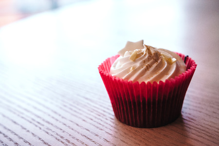 Chocolate cupcake with cream cheese icing with space for text.の写真素材