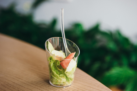 Two mini salads with sauce. Selective focus. Catering for party in restaurantの写真素材