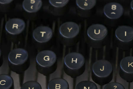 Close up of an old black typewriter keyboard with round keysの写真素材