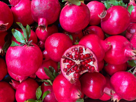 Fresh pomegranates in a box, close-up as a background.A pile of pomegranates on a farmer's market stand. Organic fruits,colorful fruits at Laika agora on the streets of Greece.の写真素材