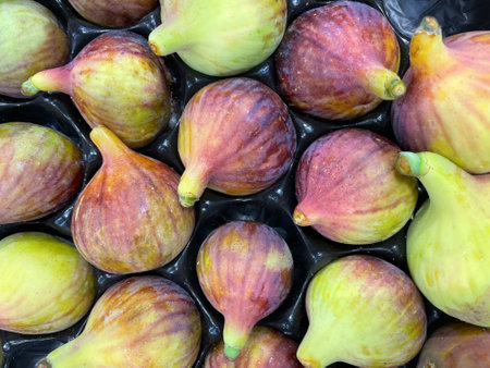 Group of figs on black background. Healthy food. Figs close-up as background in Greek market. Healthy and tasty food. Organic product. Cropped shot, background, top view.の写真素材
