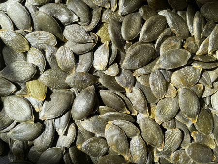 Organic pumpkin seeds without shell. Texture or background concept. Many pumpkin seeds.の写真素材