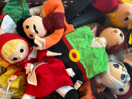 Lots of colorful toys, rag dolls in senorita/senora style dresses. Collection of colorful plush toys. Children's background.の写真素材