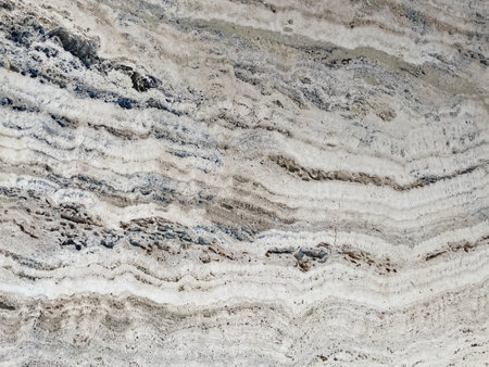 Marble Tile texture closeup as an abstract background. Natural Honed stone slab. Details of matte ceramic wall or floor. Gray surface with satin finish and a patternの写真素材
