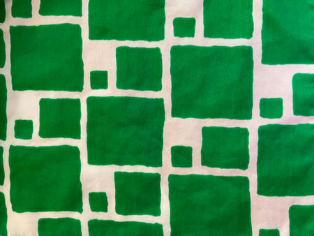 green fabric spots. Checkered pattern in grass green and white. Square mosaic. Pattern of different squares on a white background.の写真素材