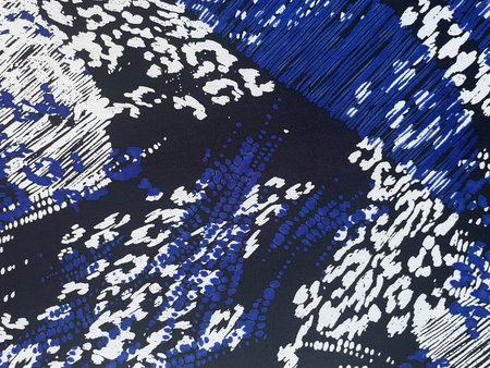 Frost pattern fabric, close-up as texture. Cotton or linen textile with scattered blue patterns. Bright frosty background. New Year backgroundの写真素材