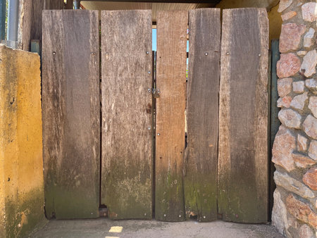 Texture wooden background close-up, old house door with natural pattern and pronounced wood grain and details. Old thingsの写真素材