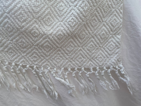 Beautiful white fabric with pattern. Empty textured background for product montage, web design, presentation. Space for text.の写真素材