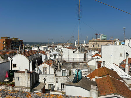 A town in Puglia, a region in southern Italy. White buildings, red tiled roofs and many antennas are very typical of this area. Church towers are visible, which is also typicalの写真素材