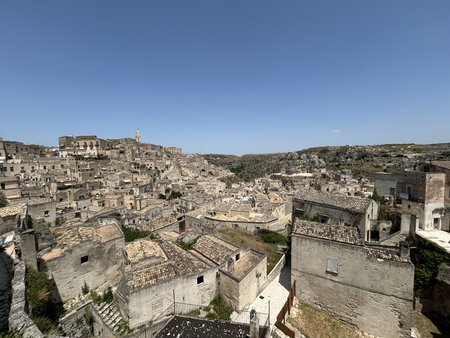 Matera, Italy. Its most distinctive feature is its ancient cave dwellings, known as "sassi," which are carved into the rock and form a unique urban landscape.の写真素材